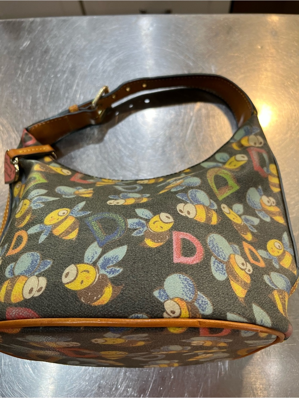 Dooney & Bourke Black Bee-Print Shoulder Bag with Brown Trim